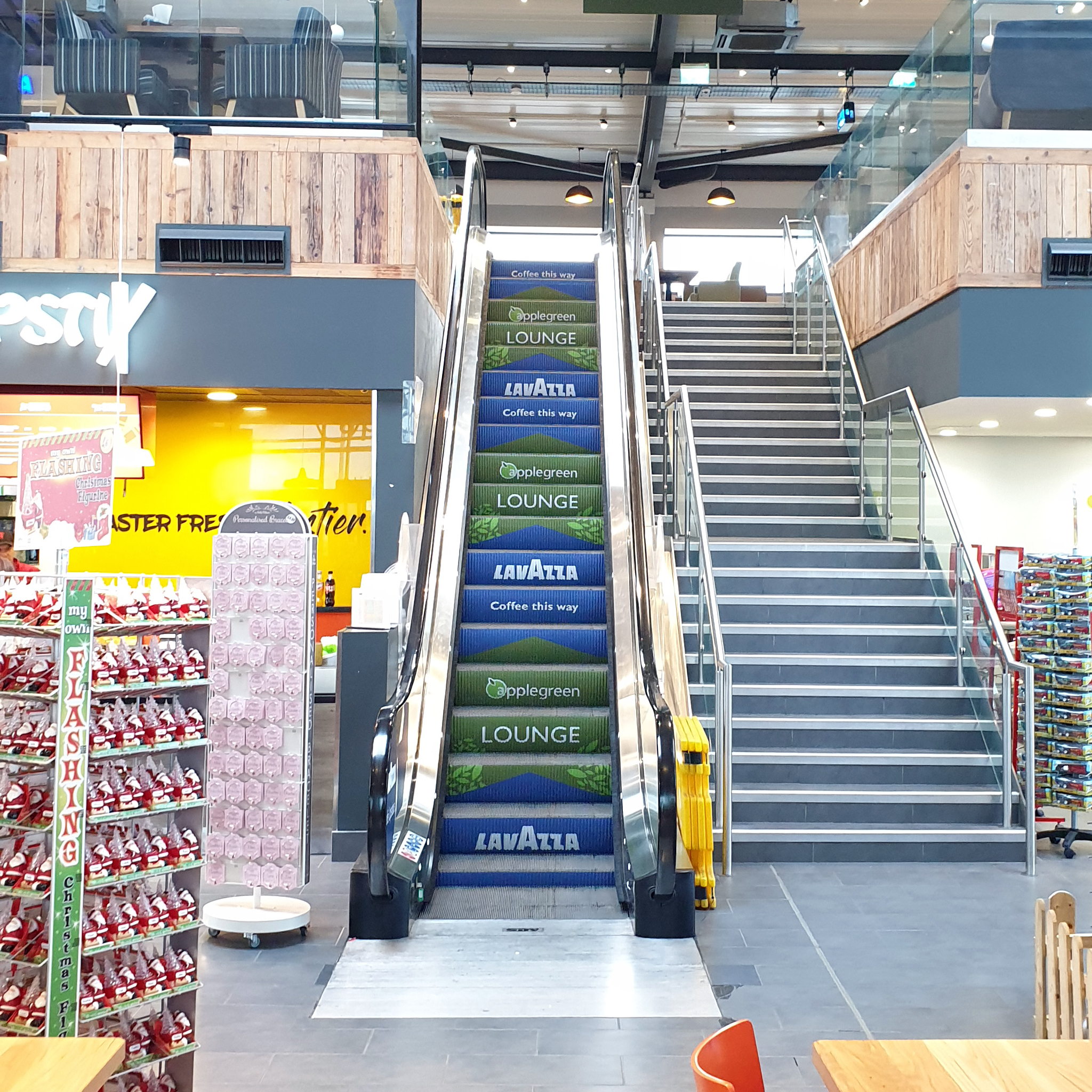 Applegreen Services Group escalator step branding campaign Northern Ireland