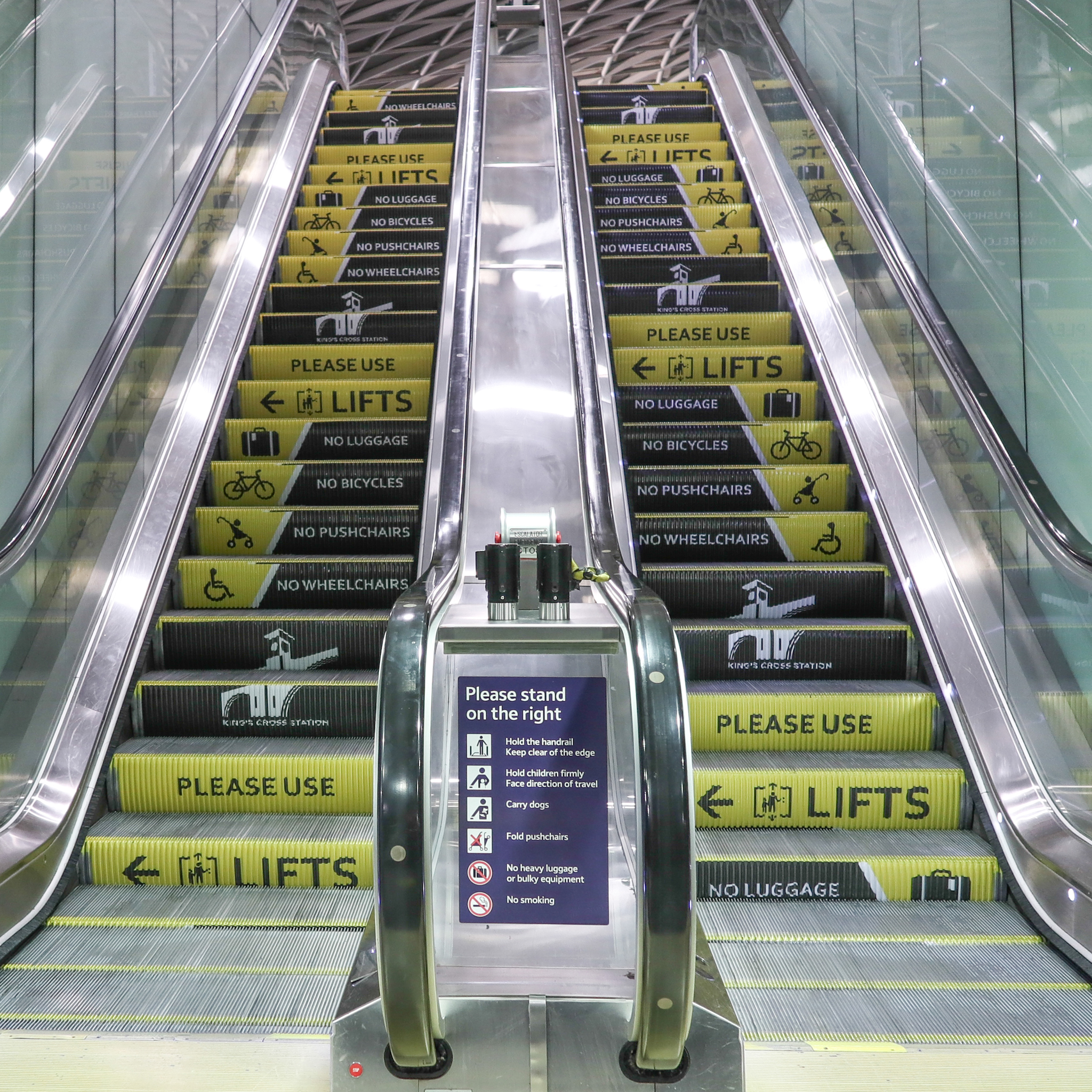 Network Rail escalator safety step branding campiagn Kings Cross Station London
